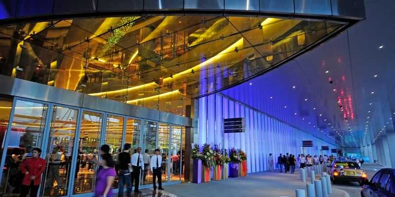 A casino entrance with people walking